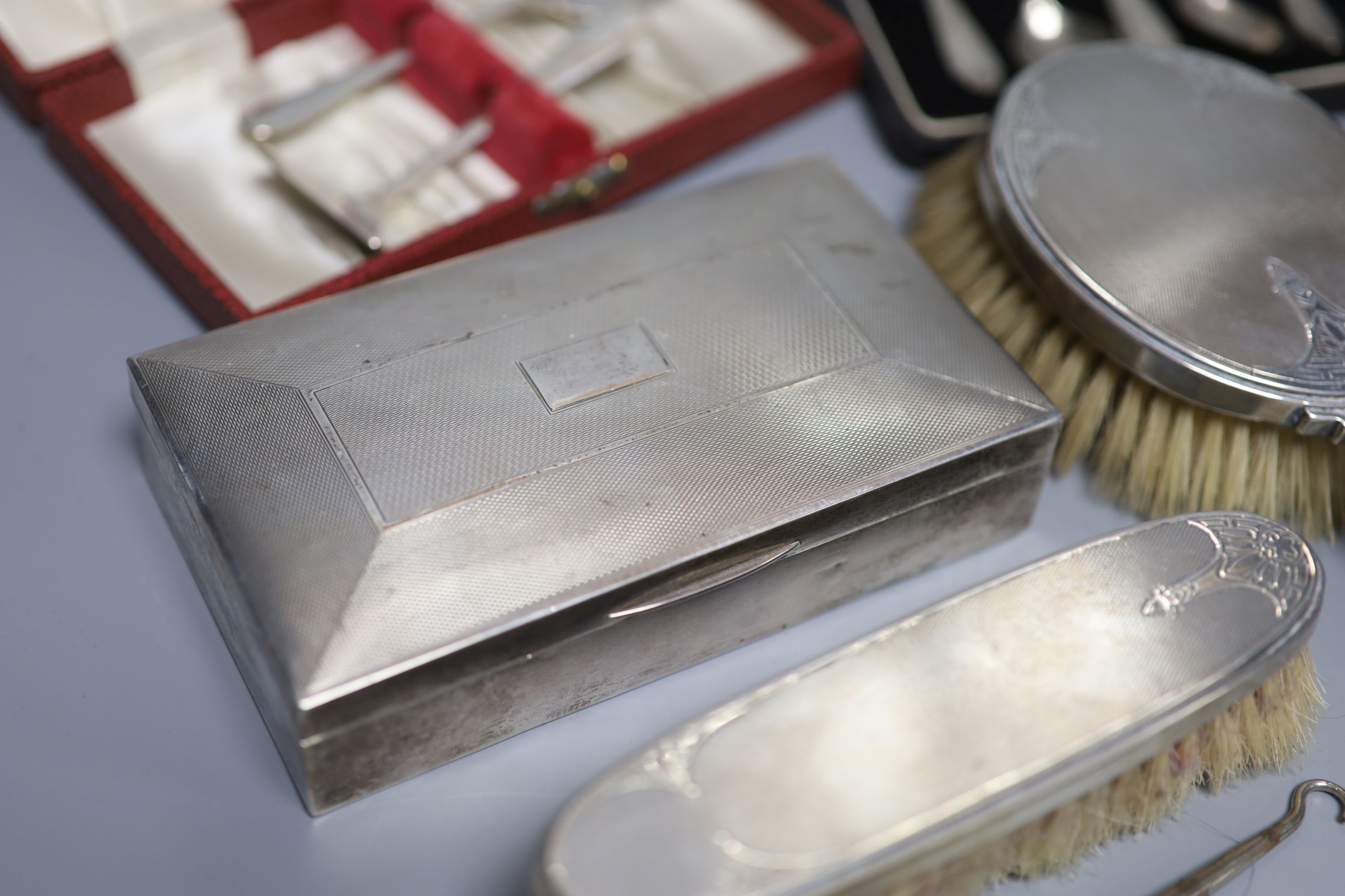 A silver cigarette case, brush set, cased spoons etc and a late Victorian miniature silver settee, Sheffield, 1897.